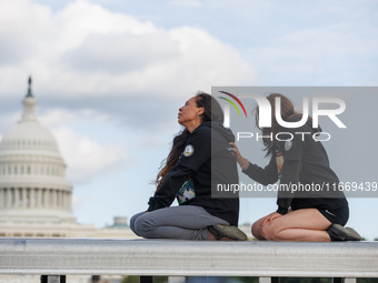 Indigenous demonstrators sit atop a horse trailer near the U.S. Capitol in Washington, D.C. on October 15, 2024 after clashing with U.S. Par...