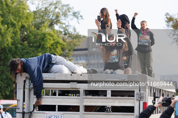 Indigenous demonstrators sit atop a horse trailer near the U.S. Capitol in Washington, D.C. on October 15, 2024 after clashing with U.S. Par...