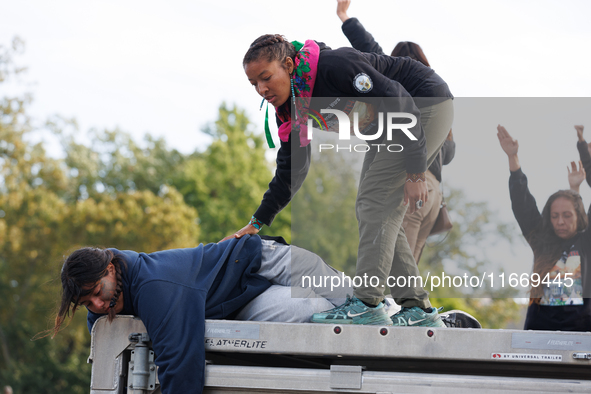 Indigenous demonstrators sit atop a horse trailer near the U.S. Capitol in Washington, D.C. on October 15, 2024 after clashing with U.S. Par...