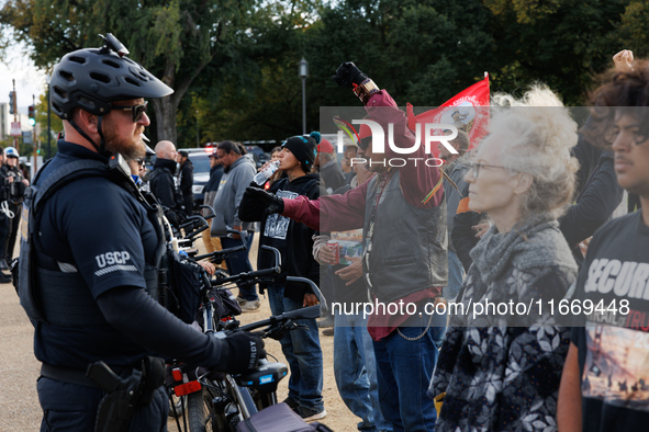 Indigenous demonstrators chant as police surround a horse trailer near the U.S. Capitol in Washington, D.C. on October 15, 2024. U.S. Park P...