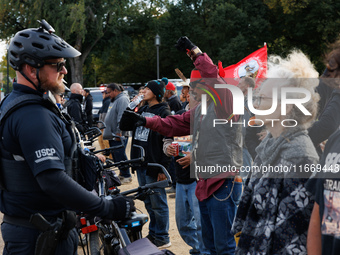 Indigenous demonstrators chant as police surround a horse trailer near the U.S. Capitol in Washington, D.C. on October 15, 2024. U.S. Park P...