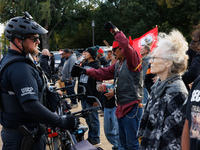 Indigenous demonstrators chant as police surround a horse trailer near the U.S. Capitol in Washington, D.C. on October 15, 2024. U.S. Park P...