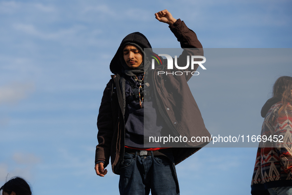 An Indigenous demonstrator stands atop a horse trailer near the U.S. Capitol in Washington, D.C. on October 15, 2024 after U.S. Park Police...