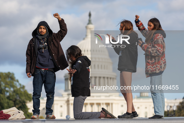 Indigenous demonstrators stand atop a horse trailer near the U.S. Capitol in Washington, D.C. on October 15, 2024 after U.S. Park Police att...