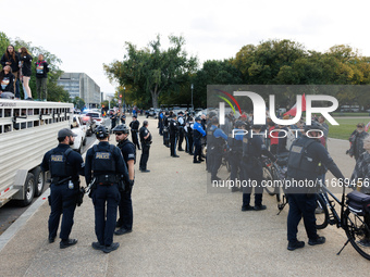 Police surround a horse trailer after Indigenous demonstrators clash with police near the U.S. Capitol in Washington, D.C. on October 15, 20...