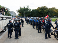 Police surround a horse trailer after Indigenous demonstrators clash with police near the U.S. Capitol in Washington, D.C. on October 15, 20...