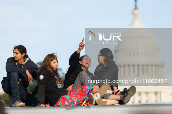 Indigenous demonstrators sit atop a horse trailer near the U.S. Capitol in Washington, D.C. on October 15, 2024 after U.S. Park Police attem...