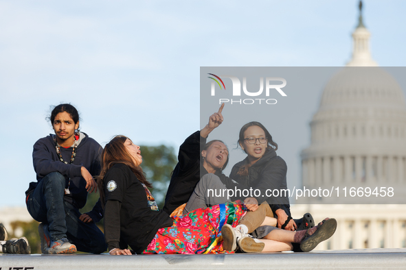 Indigenous demonstrators sit atop a horse trailer near the U.S. Capitol in Washington, D.C. on October 15, 2024 after U.S. Park Police attem...