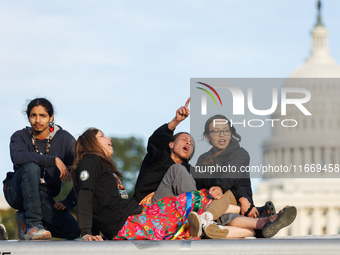 Indigenous demonstrators sit atop a horse trailer near the U.S. Capitol in Washington, D.C. on October 15, 2024 after U.S. Park Police attem...