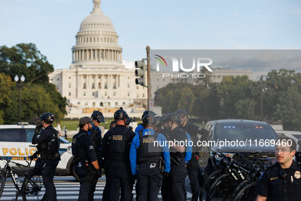 U.S. Capitol Police speak with each other after clashes with Indigenous demonstrators near the U.S. Capitol in Washington, D.C. on October 1...