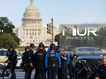 U.S. Capitol Police speak with each other after clashes with Indigenous demonstrators near the U.S. Capitol in Washington, D.C. on October 1...