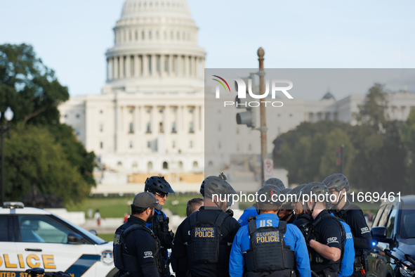 U.S. Capitol Police speak with each other after clashes with Indigenous demonstrators near the U.S. Capitol in Washington, D.C. on October 1...