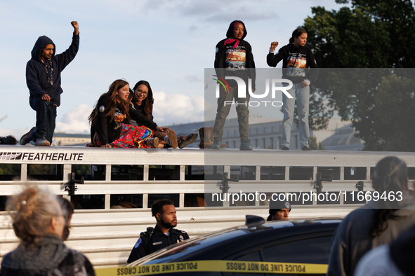 Indigenous demonstrators stand atop a horse trailer near the U.S. Capitol in Washington, D.C. on October 15, 2024 after U.S. Park Police att...