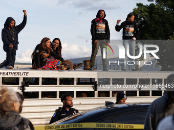 Indigenous demonstrators stand atop a horse trailer near the U.S. Capitol in Washington, D.C. on October 15, 2024 after U.S. Park Police att...