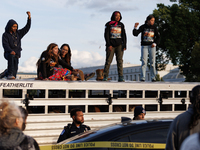 Indigenous demonstrators stand atop a horse trailer near the U.S. Capitol in Washington, D.C. on October 15, 2024 after U.S. Park Police att...