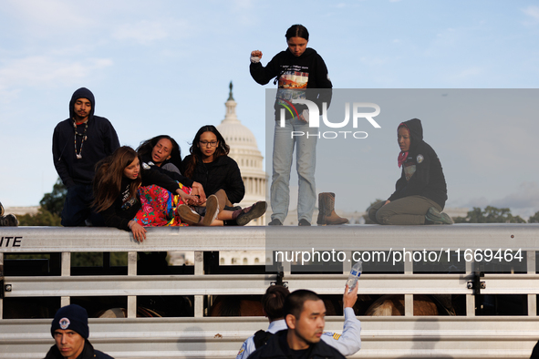 Indigenous demonstrators stand atop a horse trailer near the U.S. Capitol in Washington, D.C. on October 15, 2024 after U.S. Park Police att...