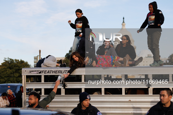 Indigenous demonstrators stand atop a horse trailer near the U.S. Capitol in Washington, D.C. on October 15, 2024 after U.S. Park Police att...