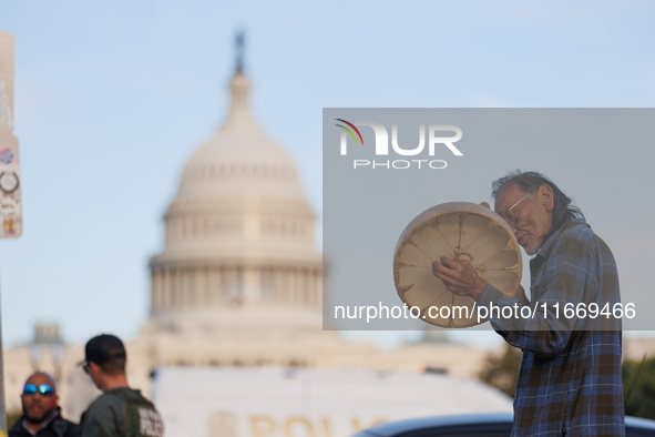 An Indigenous demonstrator plays a drum near the U.S. Capitol in Washington, D.C. on October 15, 2024. after U.S. Park Police attempted to c...