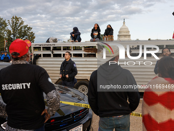 Police surround a horse trailer after Indigenous demonstrators clash with police near the U.S. Capitol in Washington, D.C. on October 15, 20...