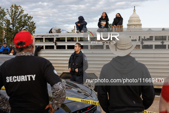 Police surround a horse trailer after Indigenous demonstrators clash with police near the U.S. Capitol in Washington, D.C. on October 15, 20...