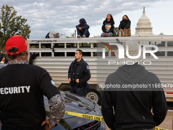 Police surround a horse trailer after Indigenous demonstrators clash with police near the U.S. Capitol in Washington, D.C. on October 15, 20...