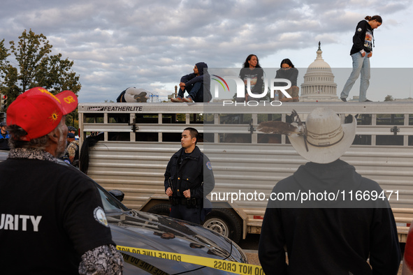 Police surround a horse trailer after Indigenous demonstrators clash with police near the U.S. Capitol in Washington, D.C. on October 15, 20...