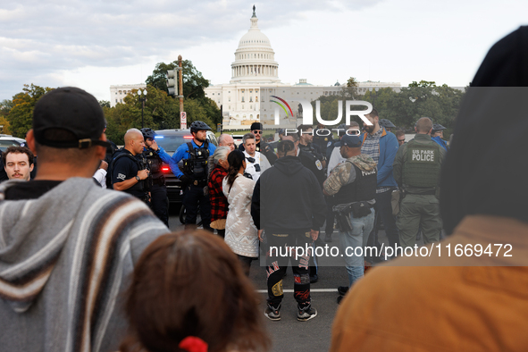 Police surround a horse trailer after Indigenous demonstrators clash with police near the U.S. Capitol in Washington, D.C. on October 15, 20...