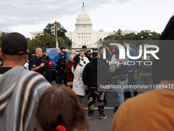 Police surround a horse trailer after Indigenous demonstrators clash with police near the U.S. Capitol in Washington, D.C. on October 15, 20...