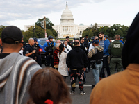 Police surround a horse trailer after Indigenous demonstrators clash with police near the U.S. Capitol in Washington, D.C. on October 15, 20...