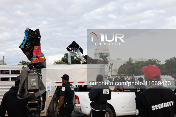 Indigenous demonstrators leave from atop a horse trailer near the U.S. Capitol in Washington, D.C. on October 15, 2024 after a standoff with...