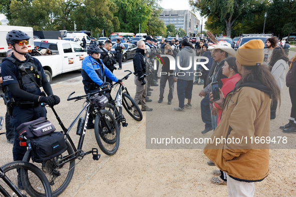 Police surround a horse trailer after Indigenous demonstrators clash with police near the U.S. Capitol in Washington, D.C. on October 15, 20...