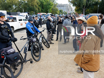 Police surround a horse trailer after Indigenous demonstrators clash with police near the U.S. Capitol in Washington, D.C. on October 15, 20...