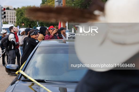 Police surround a horse trailer after Indigenous demonstrators clash with police near the U.S. Capitol in Washington, D.C. on October 15, 20...