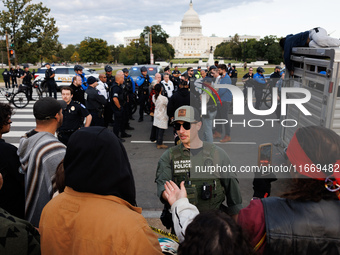 Police surround a horse trailer after Indigenous demonstrators clash with police near the U.S. Capitol in Washington, D.C. on October 15, 20...