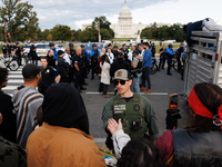 Police surround a horse trailer after Indigenous demonstrators clash with police near the U.S. Capitol in Washington, D.C. on October 15, 20...