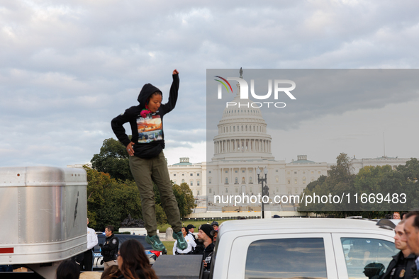 Indigenous demonstrators leave from atop a horse trailer near the U.S. Capitol in Washington, D.C. on October 15, 2024 after a standoff with...