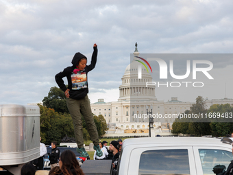 Indigenous demonstrators leave from atop a horse trailer near the U.S. Capitol in Washington, D.C. on October 15, 2024 after a standoff with...