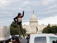 Indigenous demonstrators leave from atop a horse trailer near the U.S. Capitol in Washington, D.C. on October 15, 2024 after a standoff with...