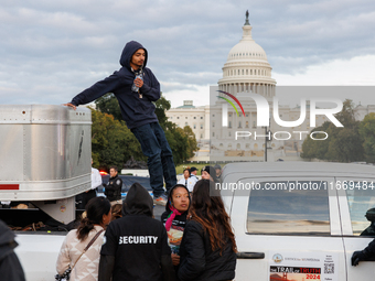 Indigenous demonstrators leave from atop a horse trailer near the U.S. Capitol in Washington, D.C. on October 15, 2024 after a standoff with...