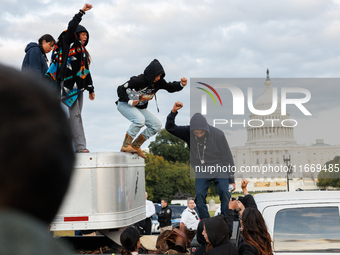 Indigenous demonstrators leave from atop a horse trailer near the U.S. Capitol in Washington, D.C. on October 15, 2024 after a standoff with...