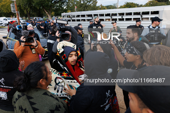 Indigenous demonstrators comfort one another near the U.S. Capitol in Washington, D.C. on October 15, 2024. after clashes with U.S. Park Pol...