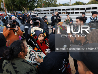 Indigenous demonstrators comfort one another near the U.S. Capitol in Washington, D.C. on October 15, 2024. after clashes with U.S. Park Pol...