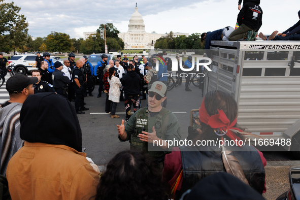 Police surround a horse trailer after Indigenous demonstrators clash with police near the U.S. Capitol in Washington, D.C. on October 15, 20...