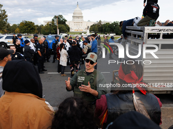 Police surround a horse trailer after Indigenous demonstrators clash with police near the U.S. Capitol in Washington, D.C. on October 15, 20...