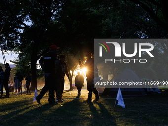 The sun sets behind an encampment erected by members of the Muwekma Ohlone Tribe of the San Francisco Bay Area, along with other tribal grou...