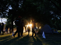 The sun sets behind an encampment erected by members of the Muwekma Ohlone Tribe of the San Francisco Bay Area, along with other tribal grou...