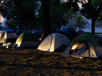 The sun sets behind an encampment erected by members of the Muwekma Ohlone Tribe of the San Francisco Bay Area, along with other tribal grou...