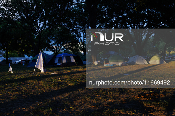 The sun sets behind an encampment erected by members of the Muwekma Ohlone Tribe of the San Francisco Bay Area, along with other tribal grou...