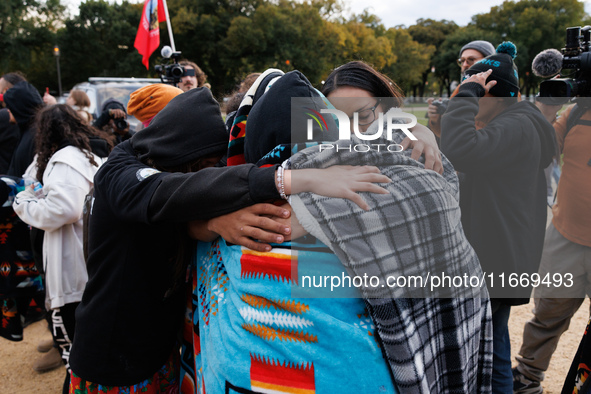 Indigenous demonstrators comfort one another near the U.S. Capitol in Washington, D.C. on October 15, 2024. after clashes with U.S. Park Pol...