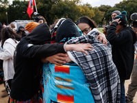 Indigenous demonstrators comfort one another near the U.S. Capitol in Washington, D.C. on October 15, 2024. after clashes with U.S. Park Pol...